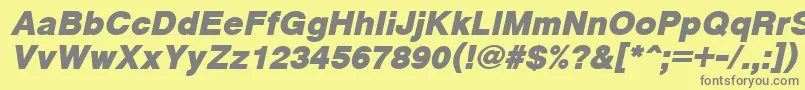 CyrveticaExtraBoldOblique-fontti – harmaat kirjasimet keltaisella taustalla