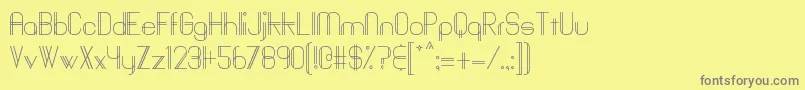 Baddit-fontti – harmaat kirjasimet keltaisella taustalla