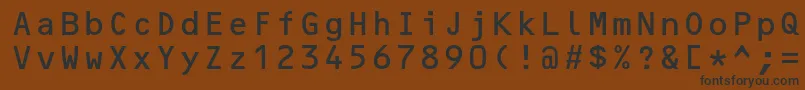 フォントOcrbstd – 黒い文字が茶色の背景にあります