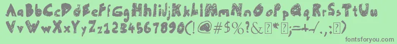 UnFinished-Schriftart – Graue Schriften auf grünem Hintergrund