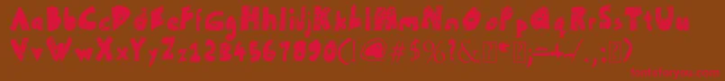 フォントUnFinished – 赤い文字が茶色の背景にあります。