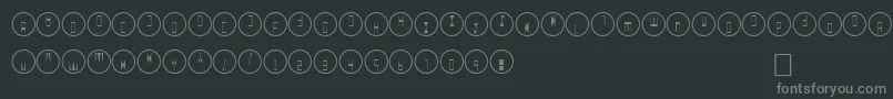 QВ°-fontti – harmaat kirjasimet mustalla taustalla