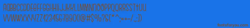 EscalopeCrustThree-Schriftart – Braune Schriften auf blauem Hintergrund