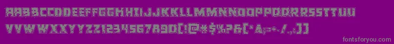 Colossusriddle-fontti – harmaat kirjasimet violetilla taustalla