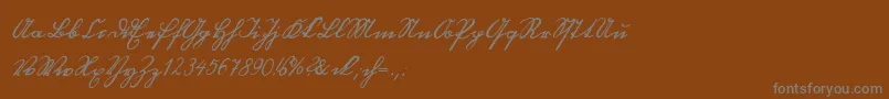 Blackletterhand-Schriftart – Graue Schriften auf braunem Hintergrund