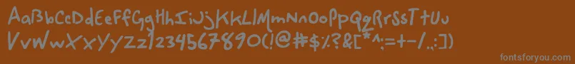 フォントSpaceCowboy. – 茶色の背景に灰色の文字