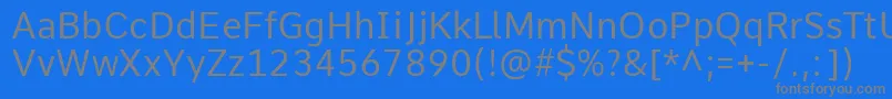 Czcionka CommeRegular1 – szare czcionki na niebieskim tle