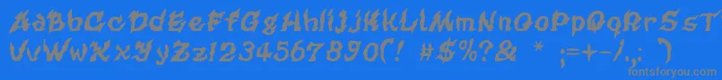 フォントCursedkuerbis – 青い背景に灰色の文字