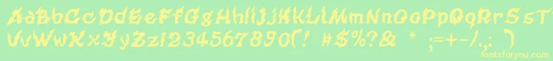 フォントCursedkuerbis – 黄色の文字が緑の背景にあります