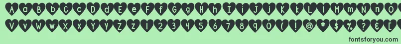 DjbShapeUpHearts Font – Black Fonts on Green Background