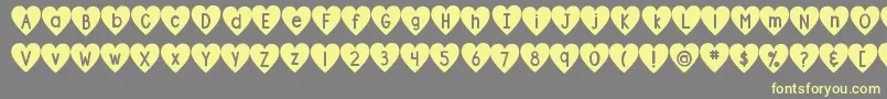 DjbShapeUpHearts Font – Yellow Fonts on Gray Background