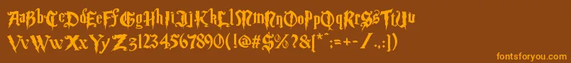 フォントMagic School Two – オレンジ色の文字が茶色の背景にあります。