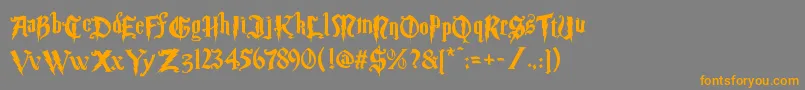 フォントMagic School Two – オレンジの文字は灰色の背景にあります。