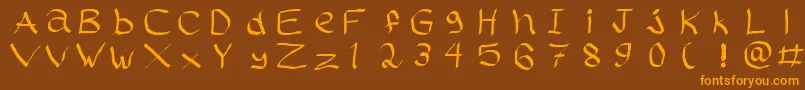 フォントRasstapp1.02 – オレンジ色の文字が茶色の背景にあります。