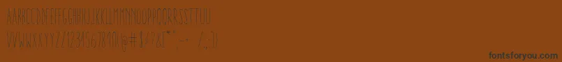 Czcionka AracneUltraCondensedLight – czarne czcionki na brązowym tle
