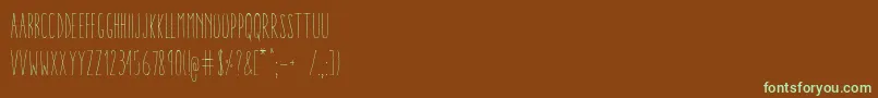 Czcionka AracneUltraCondensedLight – zielone czcionki na brązowym tle