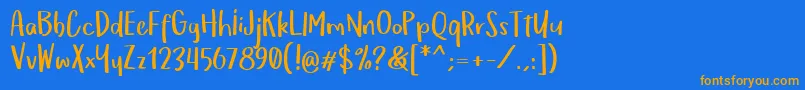 フォントOmTeloletOm – オレンジ色の文字が青い背景にあります。