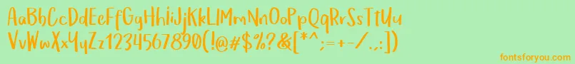 OmTeloletOm Font – Orange Fonts on Green Background