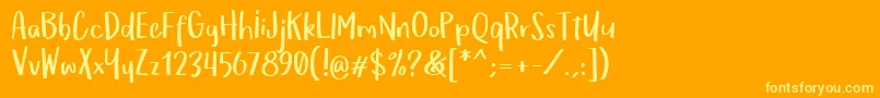 OmTeloletOm Font – Yellow Fonts on Orange Background