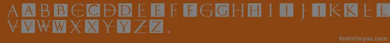 Classicromancaps-fontti – harmaat kirjasimet ruskealla taustalla