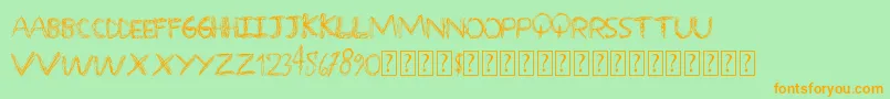 フォントOverscribble – オレンジの文字が緑の背景にあります。