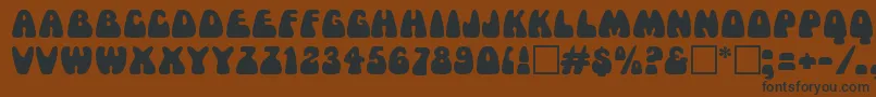 MamaRegular Font – Black Fonts on Brown Background