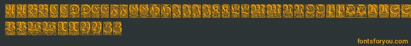 フォントUngerfrakturzierbuchstaben – 黒い背景にオレンジの文字