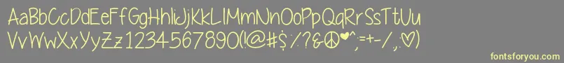 Yummycupcakes Font – Yellow Fonts on Gray Background