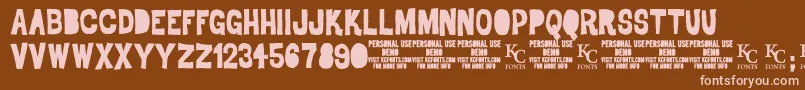 Czcionka DrodemoKcfonts – różowe czcionki na brązowym tle