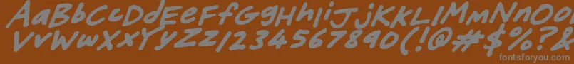 FriendlyFeltTipsItalic-fontti – harmaat kirjasimet ruskealla taustalla