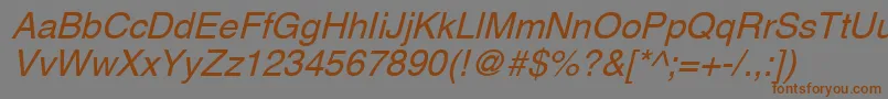 フォントAghlvcyrillicNormalItalic – 茶色の文字が灰色の背景にあります。