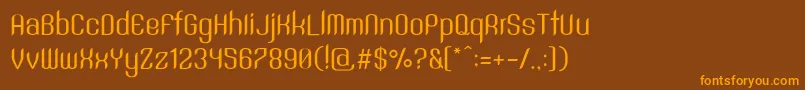 フォントSntAnouvongRegular – オレンジ色の文字が茶色の背景にあります。