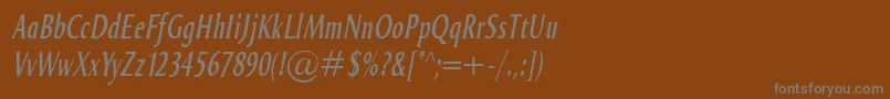 Fonte OdenseComprItalic – fontes cinzas em um fundo marrom