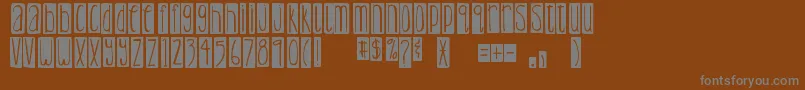Шрифт DjbLemonHeadBlocked – серые шрифты на коричневом фоне