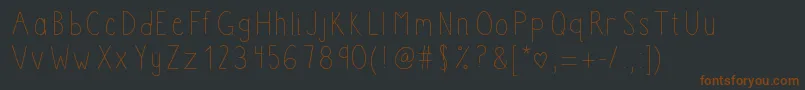 Boomclapac-Schriftart – Braune Schriften auf schwarzem Hintergrund