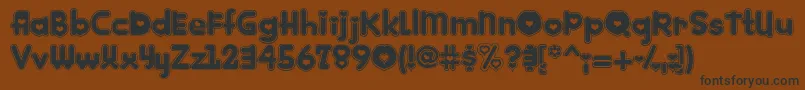 Kinkie-Schriftart – Schwarze Schriften auf braunem Hintergrund