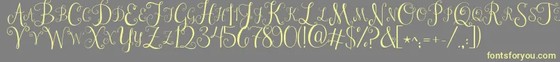 Jandastylishmonogram-Schriftart – Gelbe Schriften auf grauem Hintergrund