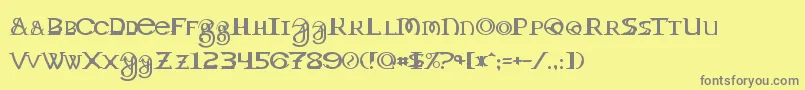 Toril-fontti – harmaat kirjasimet keltaisella taustalla