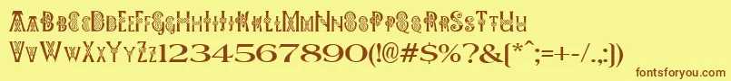 フォントPeesCelticPlain – 茶色の文字が黄色の背景にあります。