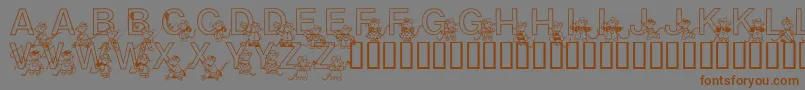 フォントMousie – 茶色の文字が灰色の背景にあります。