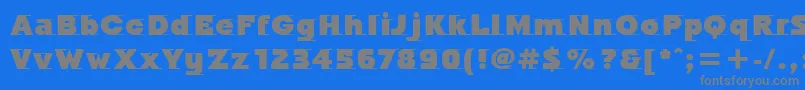 フォントOdysseeItcUltra – 青い背景に灰色の文字