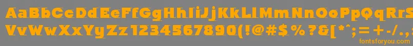 フォントOdysseeItcUltra – オレンジの文字は灰色の背景にあります。