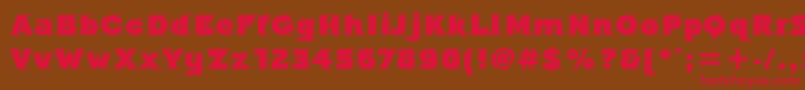 フォントOdysseeItcUltra – 赤い文字が茶色の背景にあります。