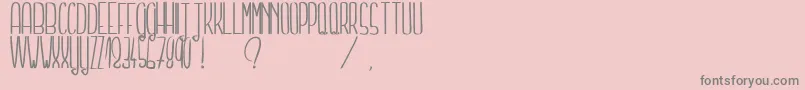 Lisätietoja TellMeASecretLight-fontista TellMeASecretLight-fontti – harmaat kirjasimet vaaleanpunaisella taustalla