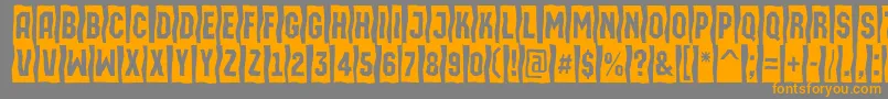 フォントAMachinaortosls – オレンジの文字は灰色の背景にあります。