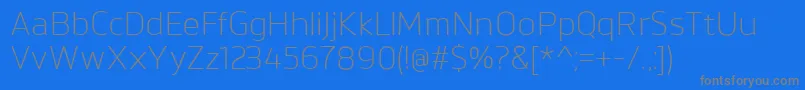 フォントBrokmanLight – 青い背景に灰色の文字