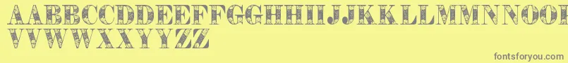 Шрифт Tendrilspersonaluse – серые шрифты на жёлтом фоне