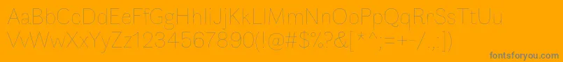 FauneDisplaythin-Schriftart – Graue Schriften auf orangefarbenem Hintergrund