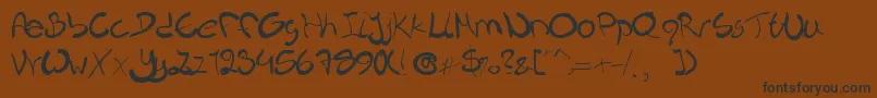 Nieknique Font – Black Fonts on Brown Background