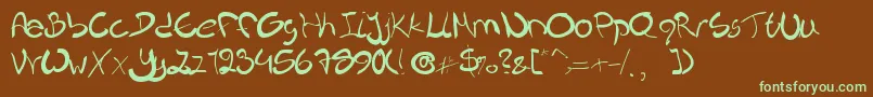 フォントNieknique – 緑色の文字が茶色の背景にあります。
